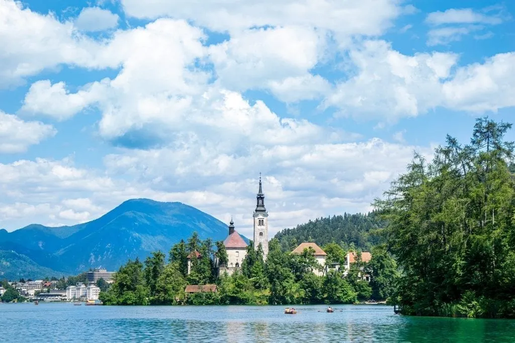 View of Bled Island in the distance, as seen from across the water in Bled Slovenia