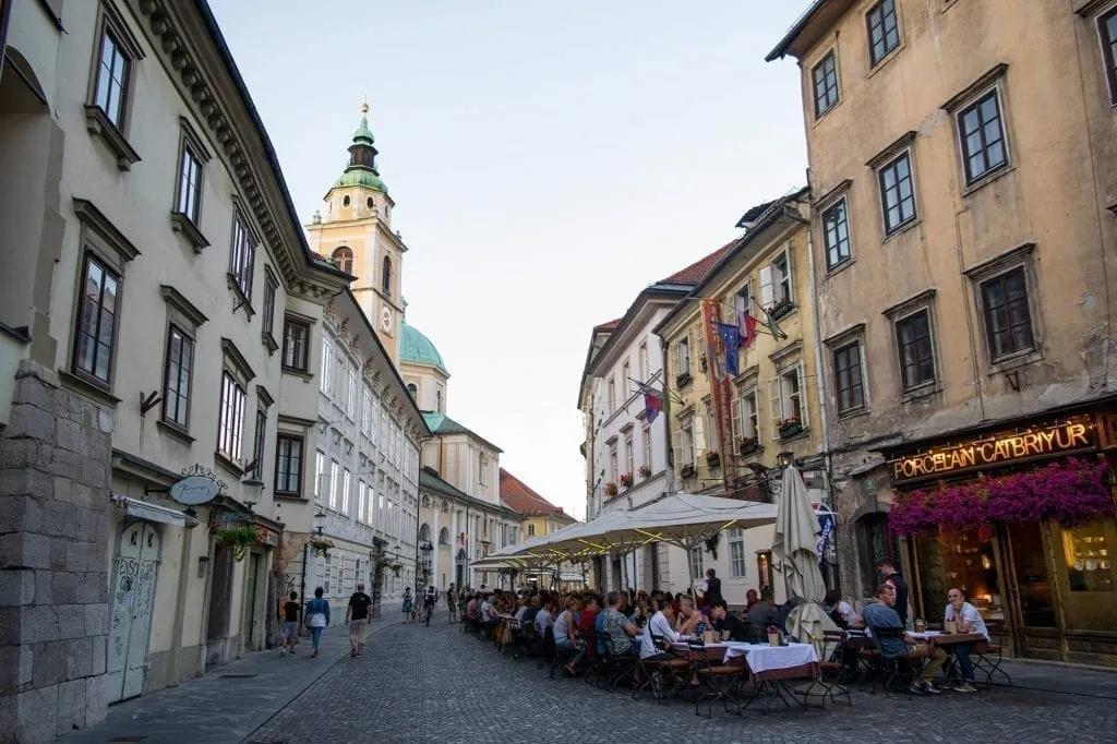 Small street in Ljubljana Slovenia with a cafe on the right