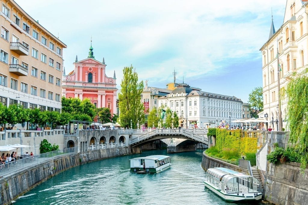 River in Ljubljana with Preseren Square visible in the background. Ljubljana is the first stop on this 7 days in Slovenia itinerary