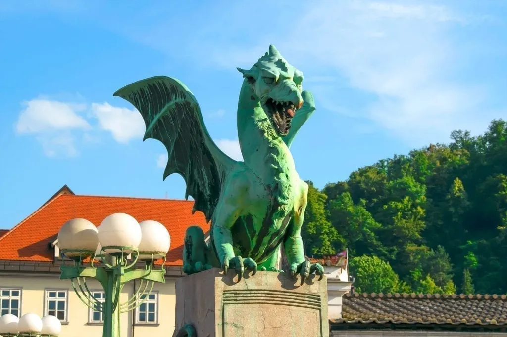 Green dragon as seen on Dragon Bridge in Ljubljana Slovenia, one of the best places to visit in Slovenia