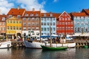 Nyhavn Harbor on a sunny day in Copenhagen Denmark, one of the best cities to visit in Europe