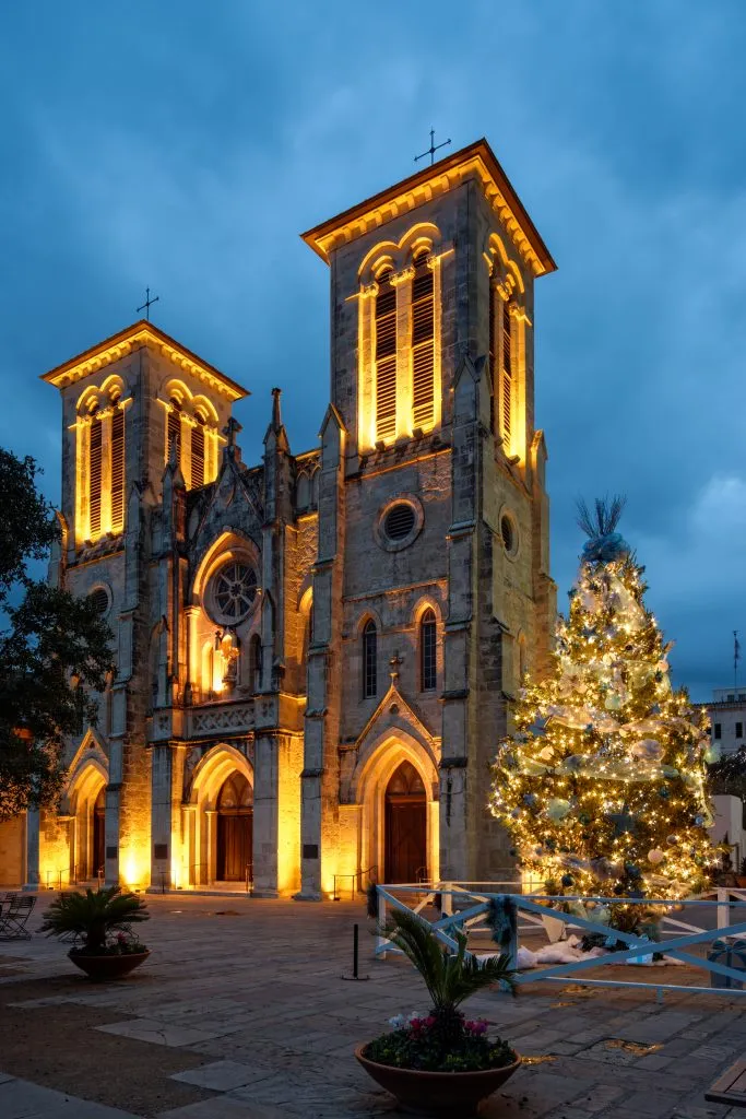 san fernando cathedral at night in december with christmas tree in the foreground