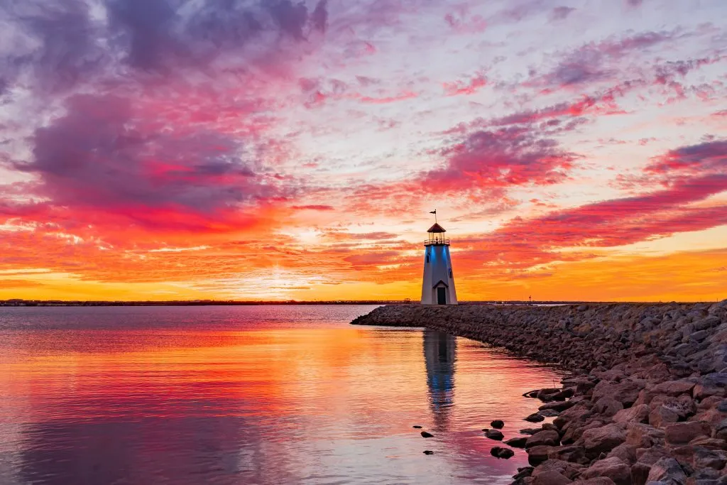 lake hefner lighthouse during a brilliant orange sunset in okc