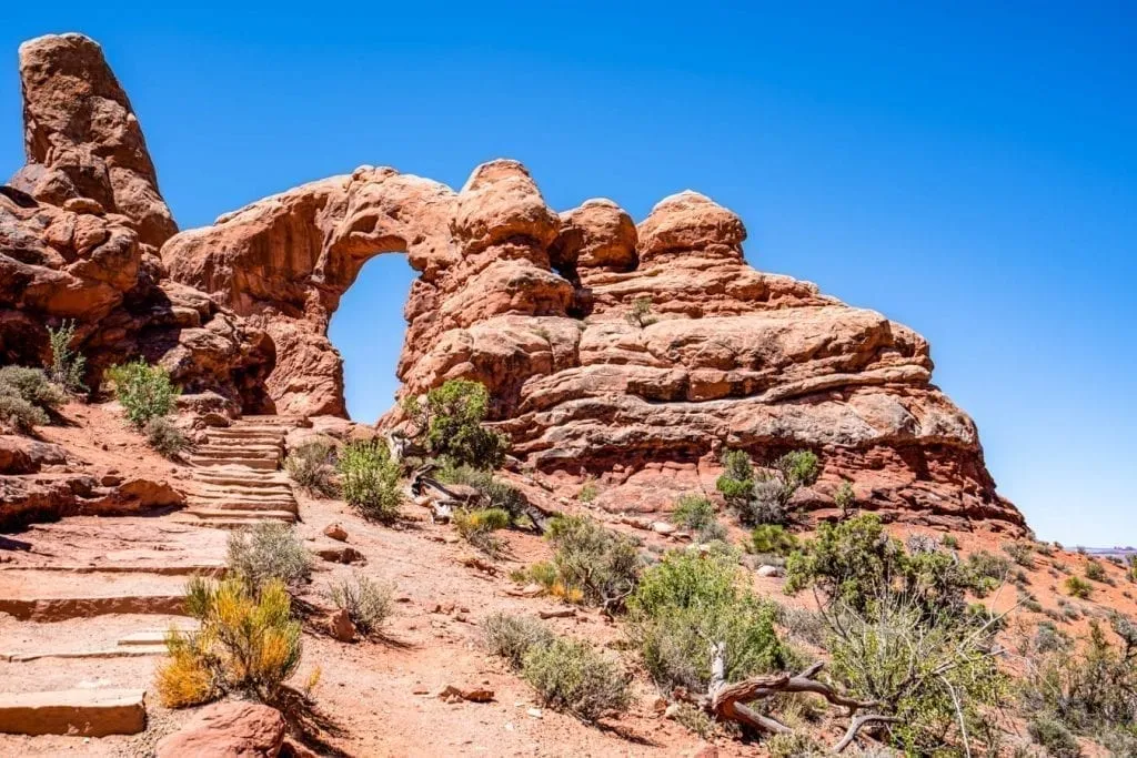 view of  turret arch with trail in the foreground, a fun stop on scenic drive arches itinerary