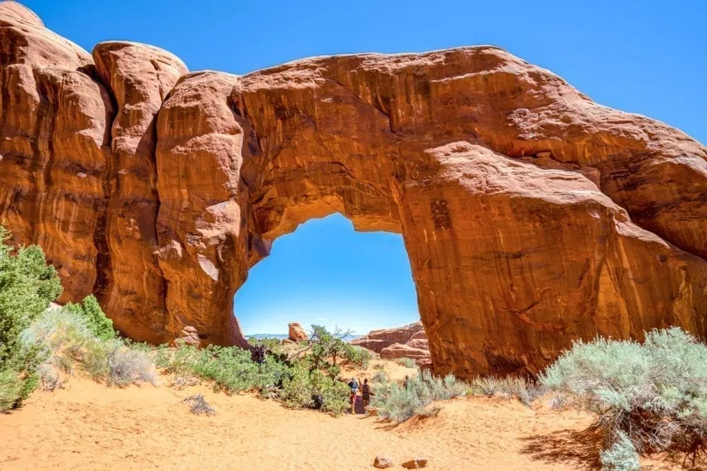 pine arch in arches national park in a day filled with sunshine