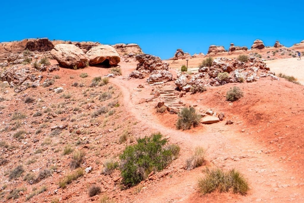 Trail to Delicate Arch Upper Viewpoint with the arch visible in the background.