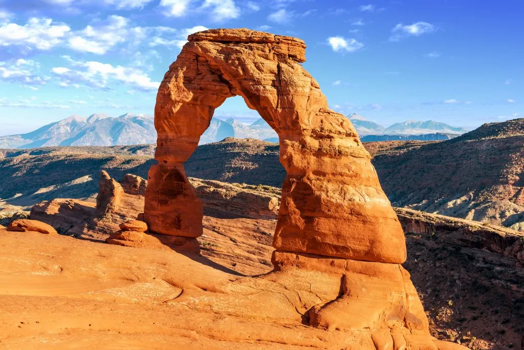 delicate arch on a sunny day, the view at the end of the delicate arch hike in arches national park