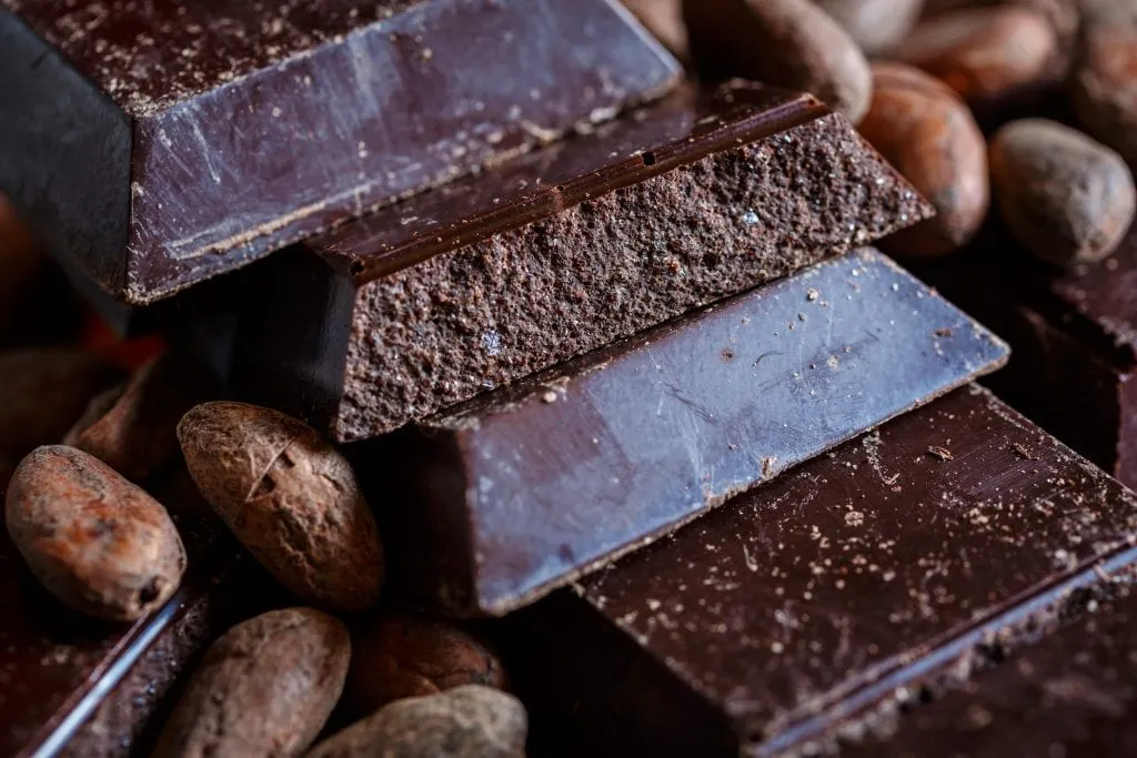 4 bars of cioccolato di modica stacked on top of each other, cioccolato di modica is a traditional food in sicily