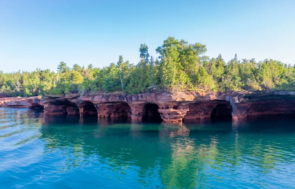 sea caves as seen from the water at apostle islands, one of the best places to visit in the us