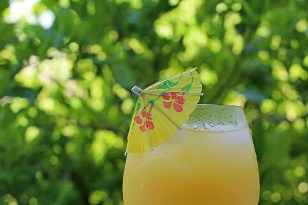 fresh orange juice with an umbrella in it, one of the popular breakfast foods in mexico