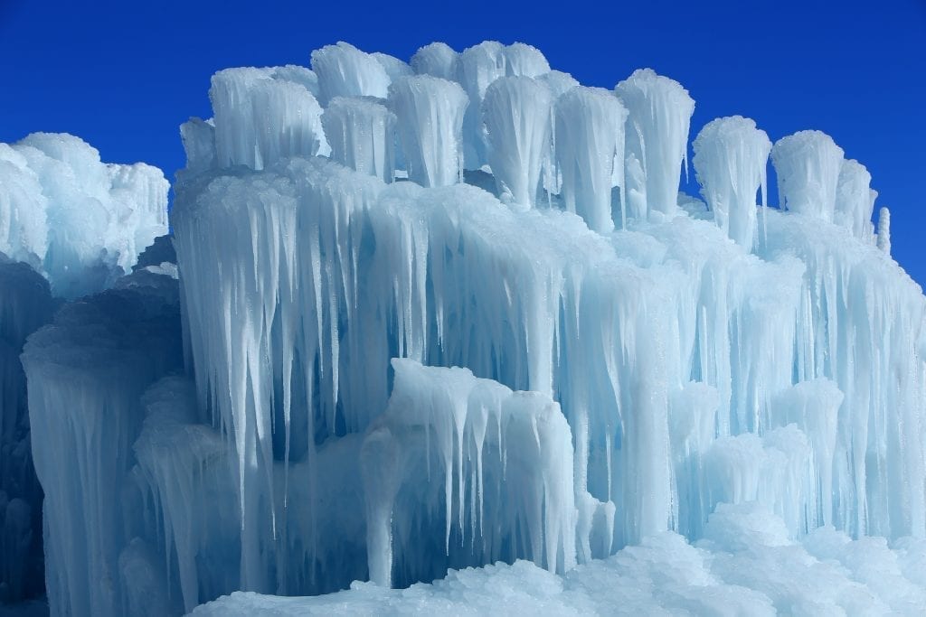 Ice Castle in Utah under a blue sky