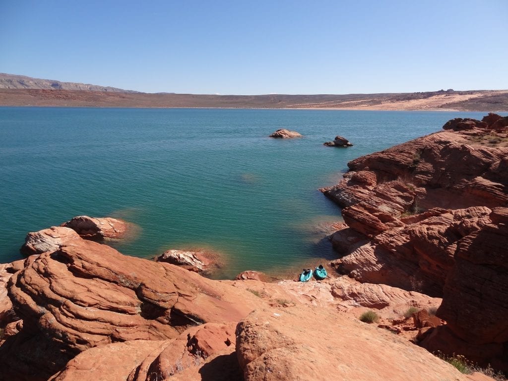 Lake surrounded by red rock in Sand Hollow State Park, one of the best places to see in Utah