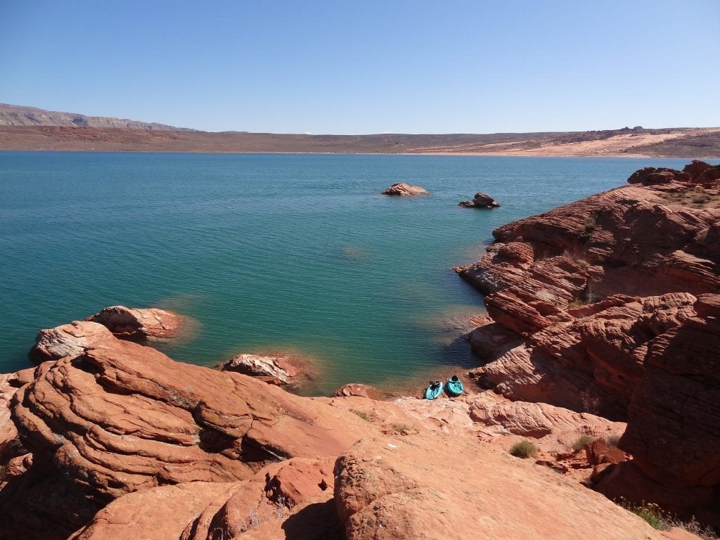 Lake surrounded by red rock in Sand Hollow State Park, one of the best places to see in Utah