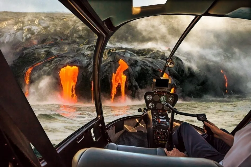 Helicopter tour of Volcano National Park in Hawaii shot from inside the helicopter with lava visible through the windshield