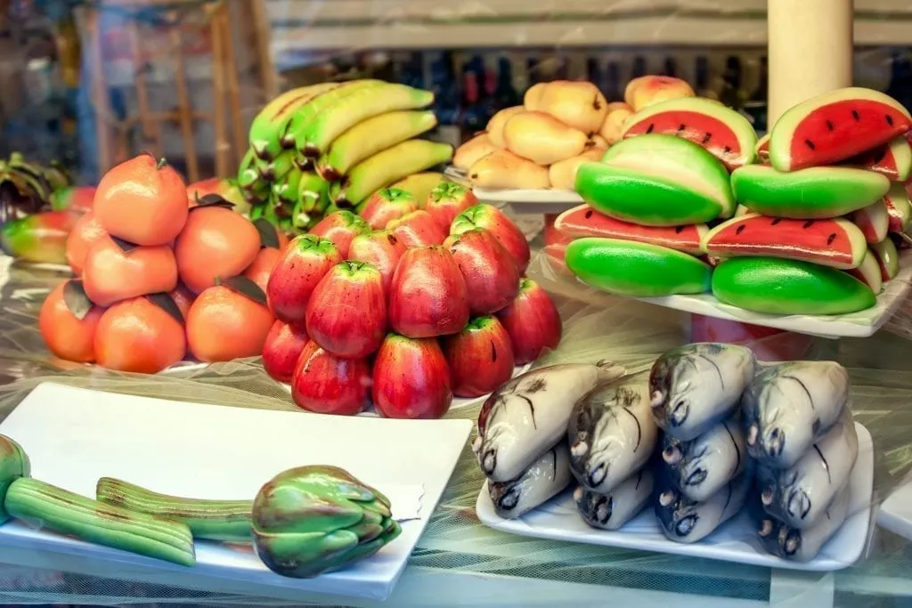Marzipans shaped as fruits and vegetables in a shop window