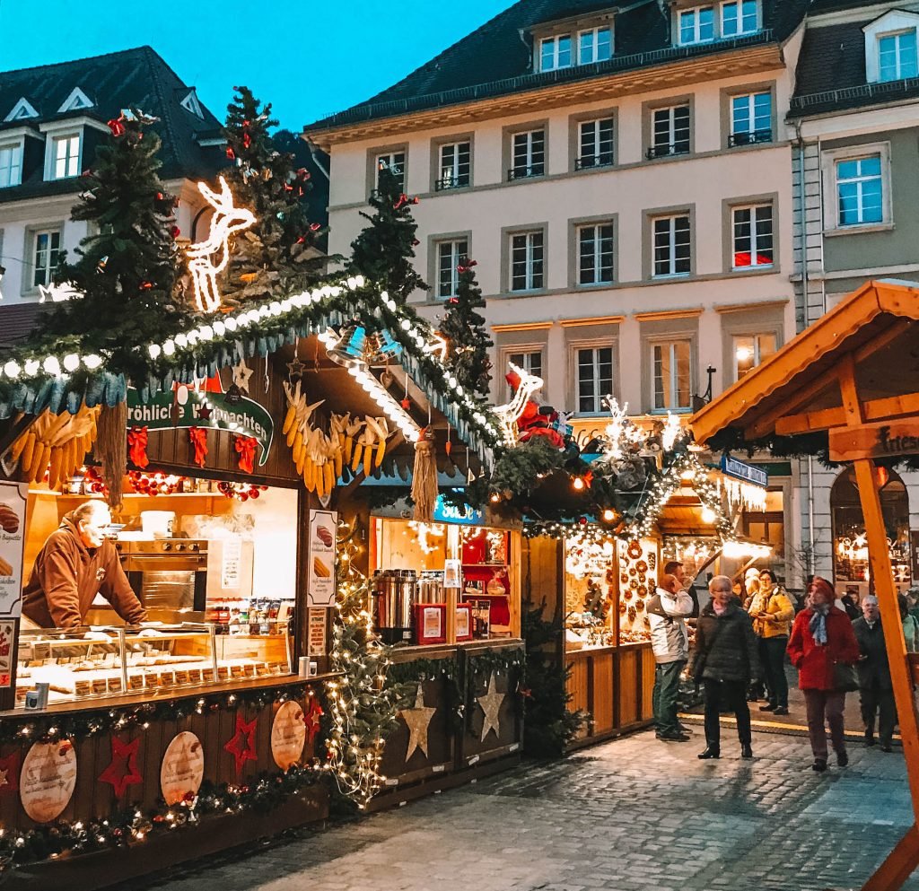 photo of heidelberg germany christmas market stalls at blue hour