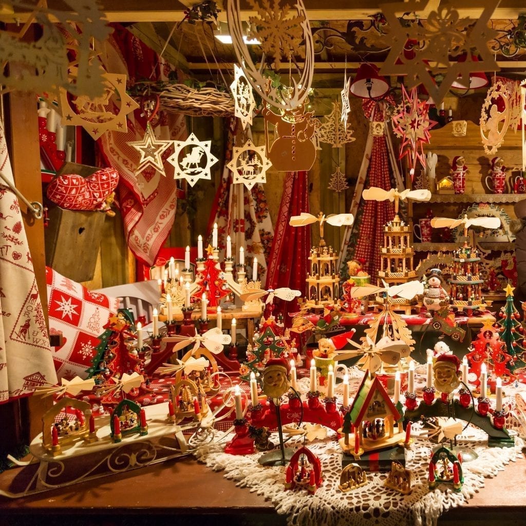 Photo of wooden ornaments and other holiday decor for sale at one of the Christmas markets in France