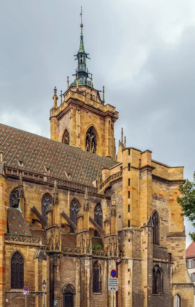 exterior facade of st martins church on a cloudy day, one of the best places to visit in colmar alsace