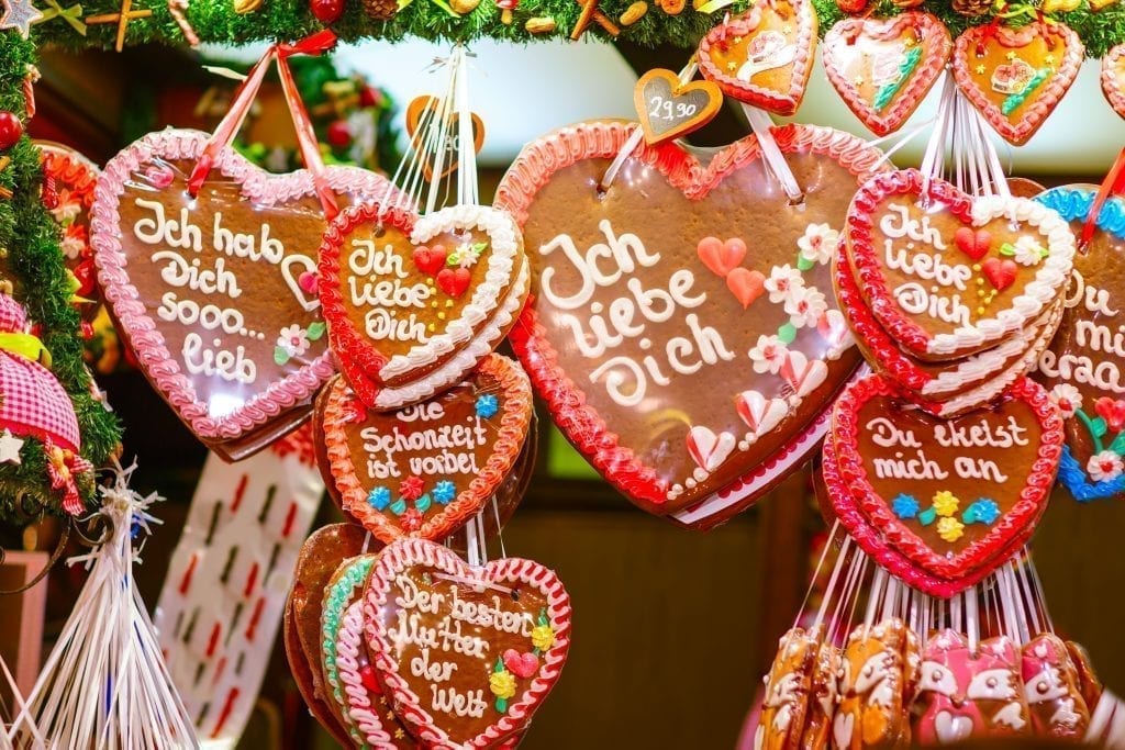 Gingerbread hearts hanging in a booth at a German Christmas market. The best European Christmas markets are often found in Germany!