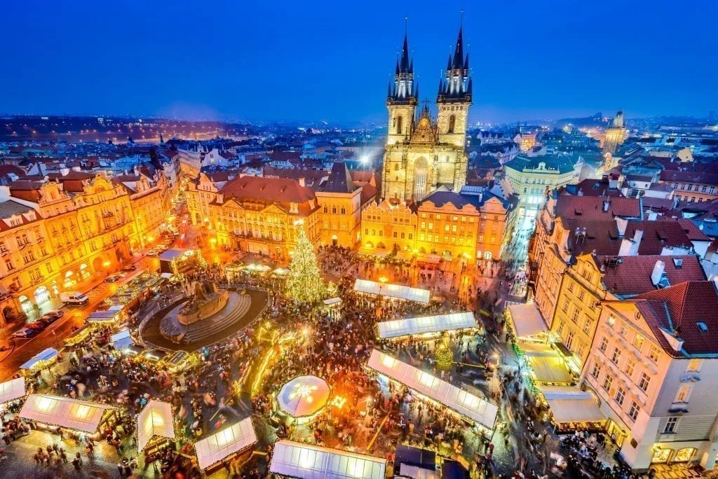 Prage Christmas market in its central square as seen from above during blue hour. Prague has some of the best Christmas markets in Europe