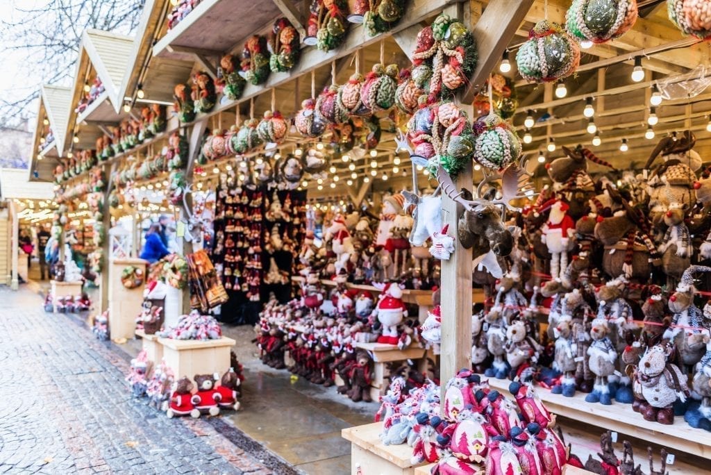 Ornaments for sale in wooden Christmas market stalls in Manchester England, home of some of the best European Christmas markets