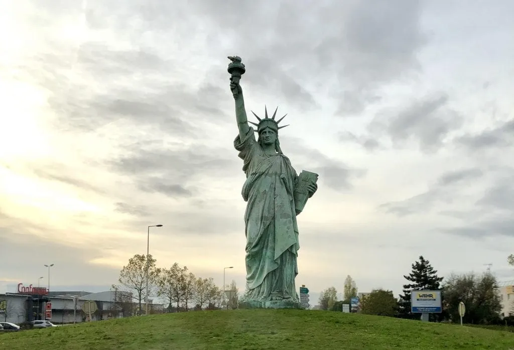 Photo of the replica of the Statue of Liberty in Colmar France on a cloudy day near sunset