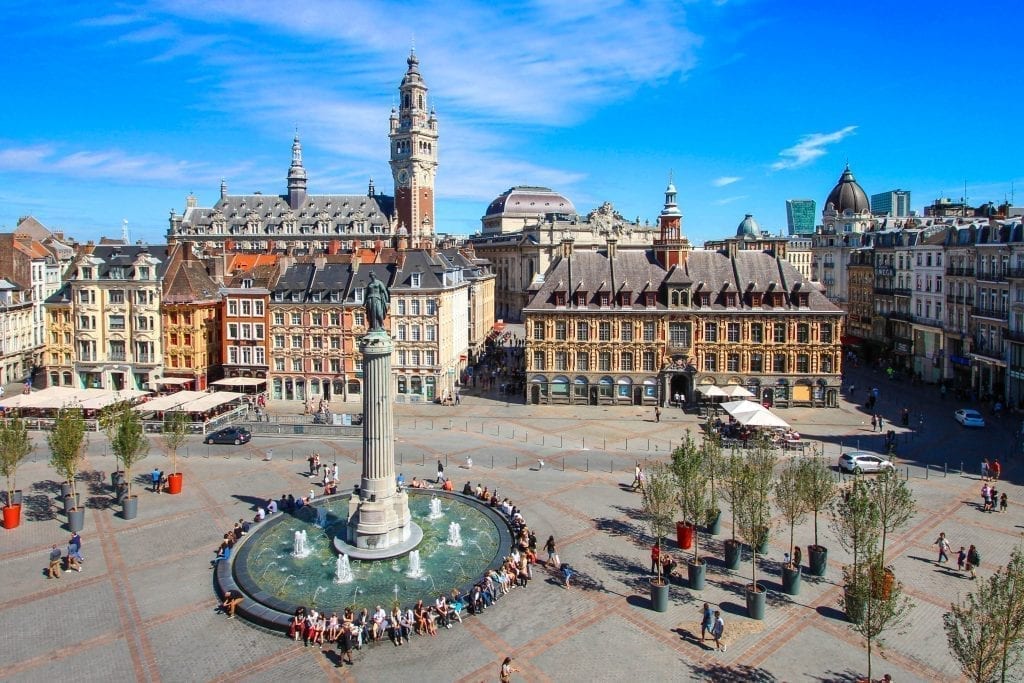 vieux lille as seen from above with a fountain in the foreground