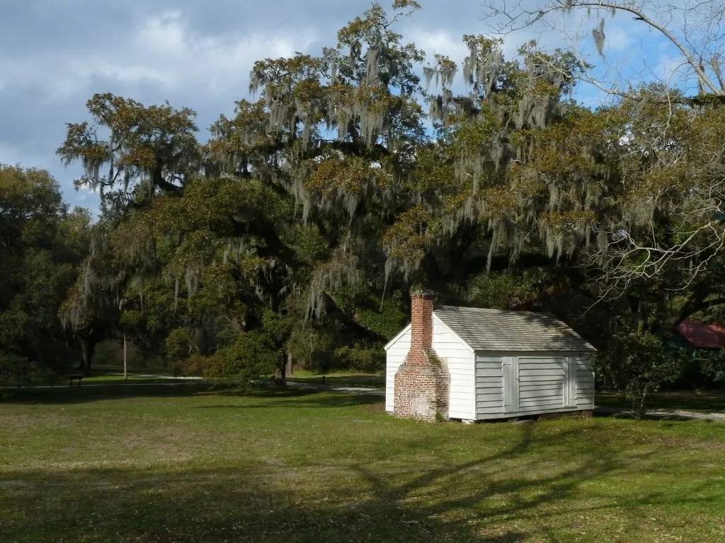 Small white cabin that enslaved people lived in on Mcleod plantation near charleston sc