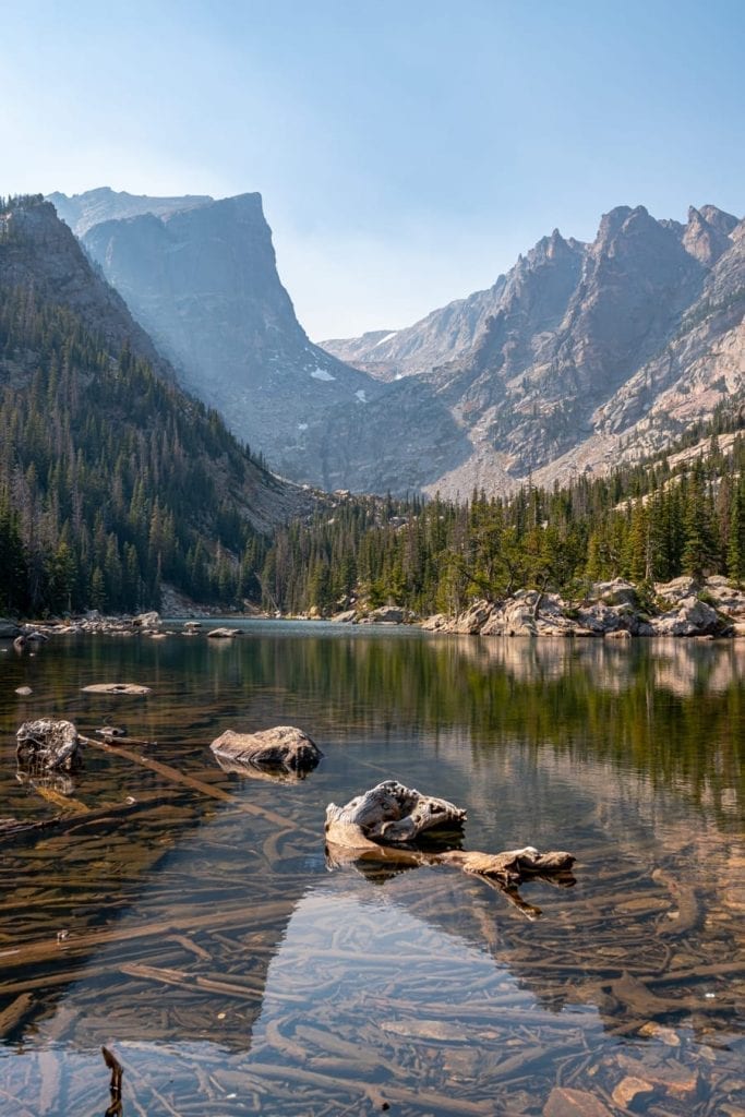 vertical photo of dream lake in rocky mountains national park hiking trail