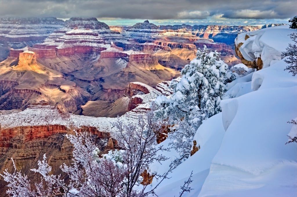 Grand Canyon in winter taken from the rim with snow in the foreground