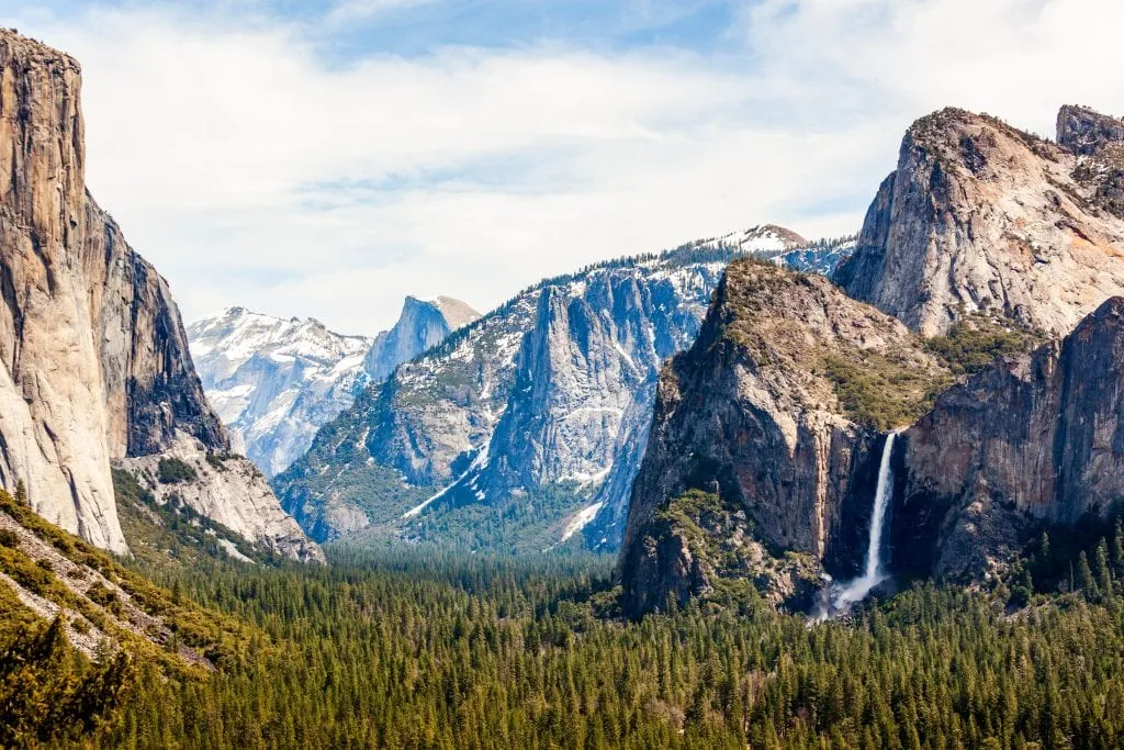 Yosemite national park as seen from above, one of the top national parks in america. yosemite falls is visible in the background