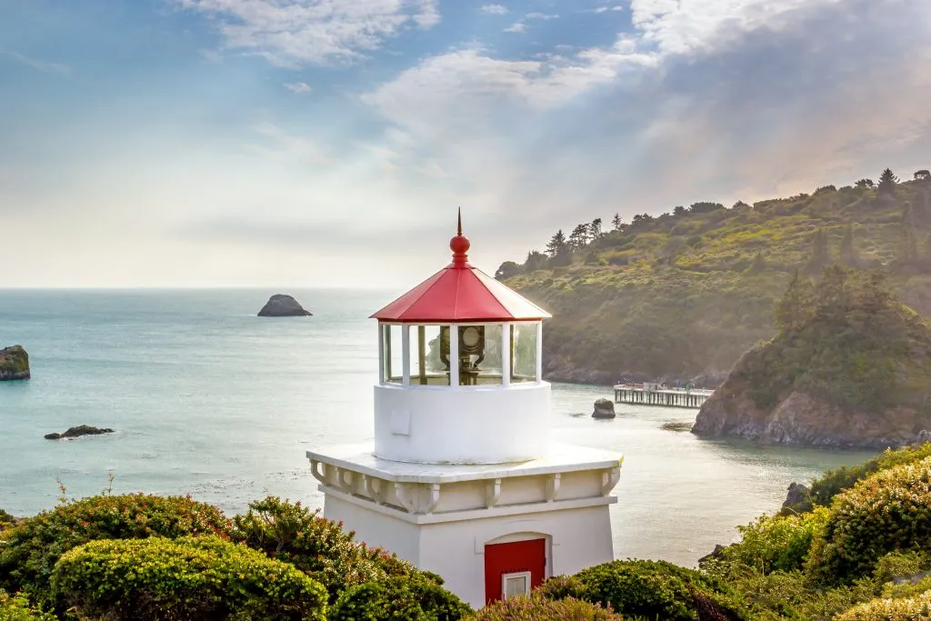 white and red lighthouse in trinidad california, one of the prettiest small towns in america