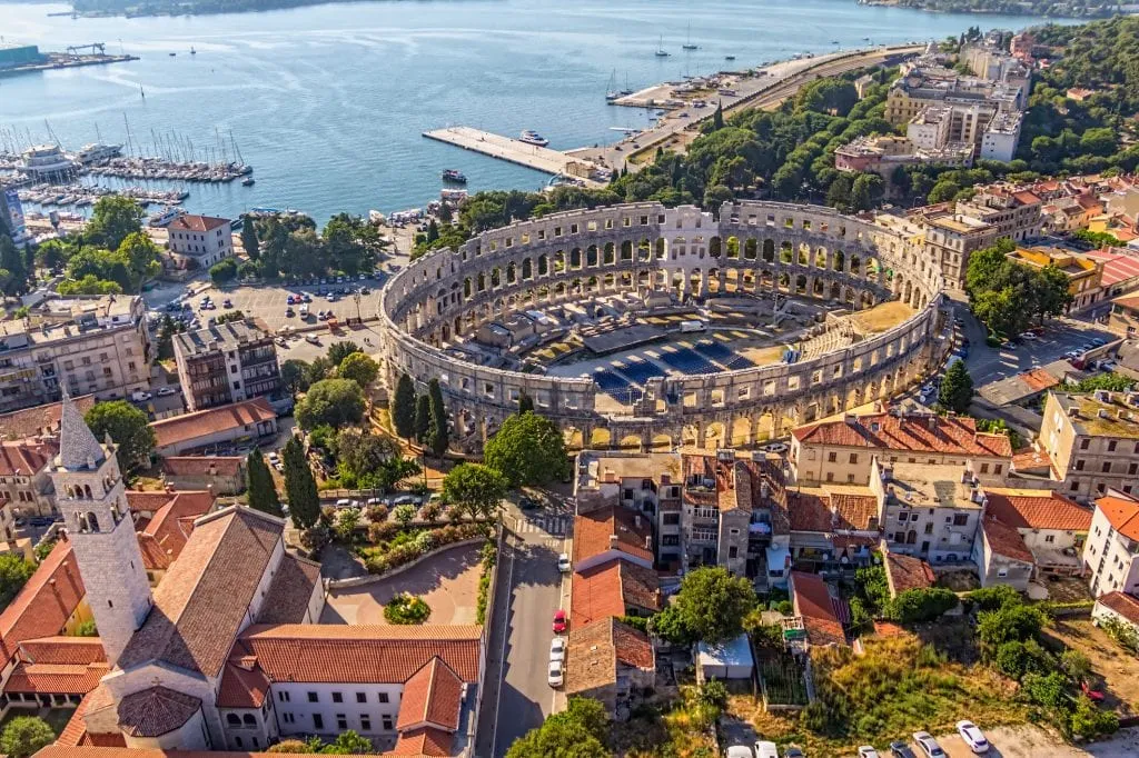 pula croatia as seen from above via a drone with amphitheater in the center. pula is one of the best places to visit in croatia