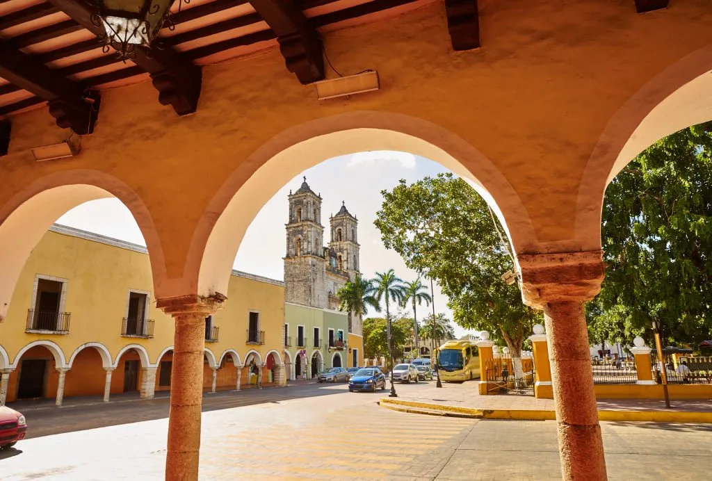 view of valladolid zocalo from under a portico. the zocalo is one of the best things to do in valladolid mexico