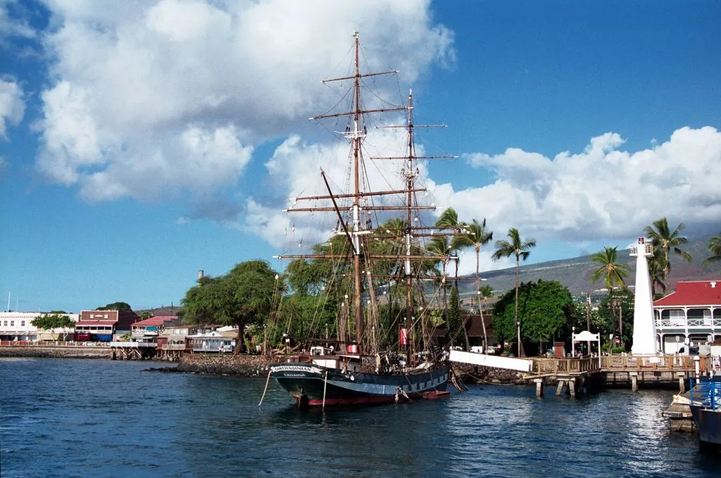 lahaina maui harbor with a tall ship in it, one of the best small us towns