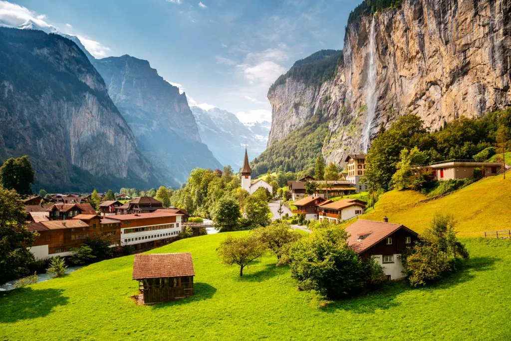 village of lauterbrannen switzerland with waterfall visible on the right