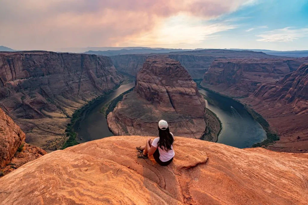 kate storm in front of horseshoe bend page az at the beginning of sunset