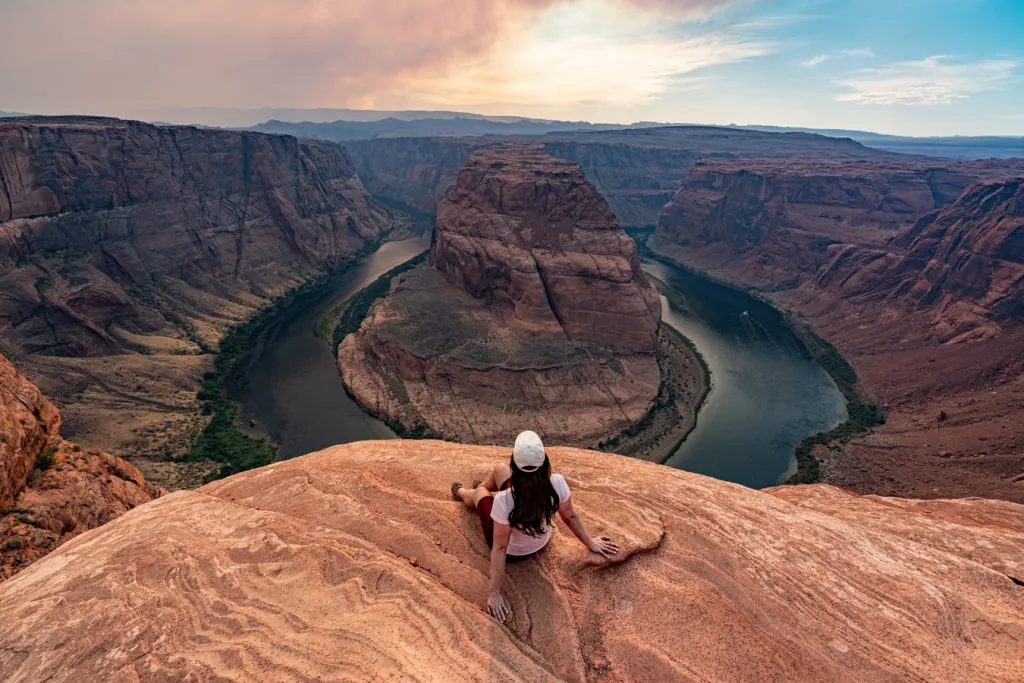 kate storm admiring horseshoe bend at sunset