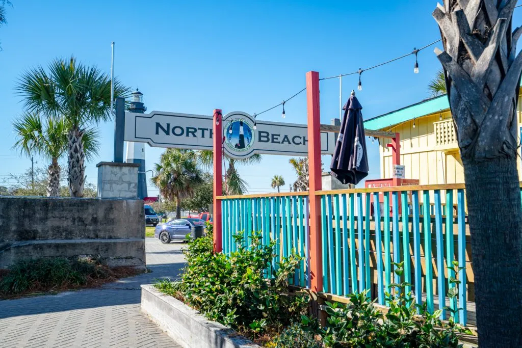 sign for north beach near a colorful shop in savannah's beach georgia