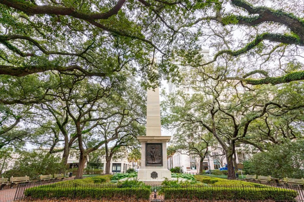 monument in one of the best savannah squares surrounded by oak trees