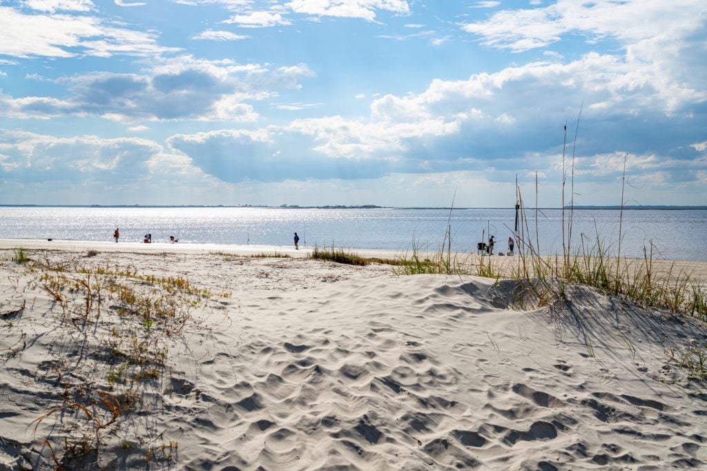 sandy path leading to a calm beach, one of the best attractions jekyll island georgia