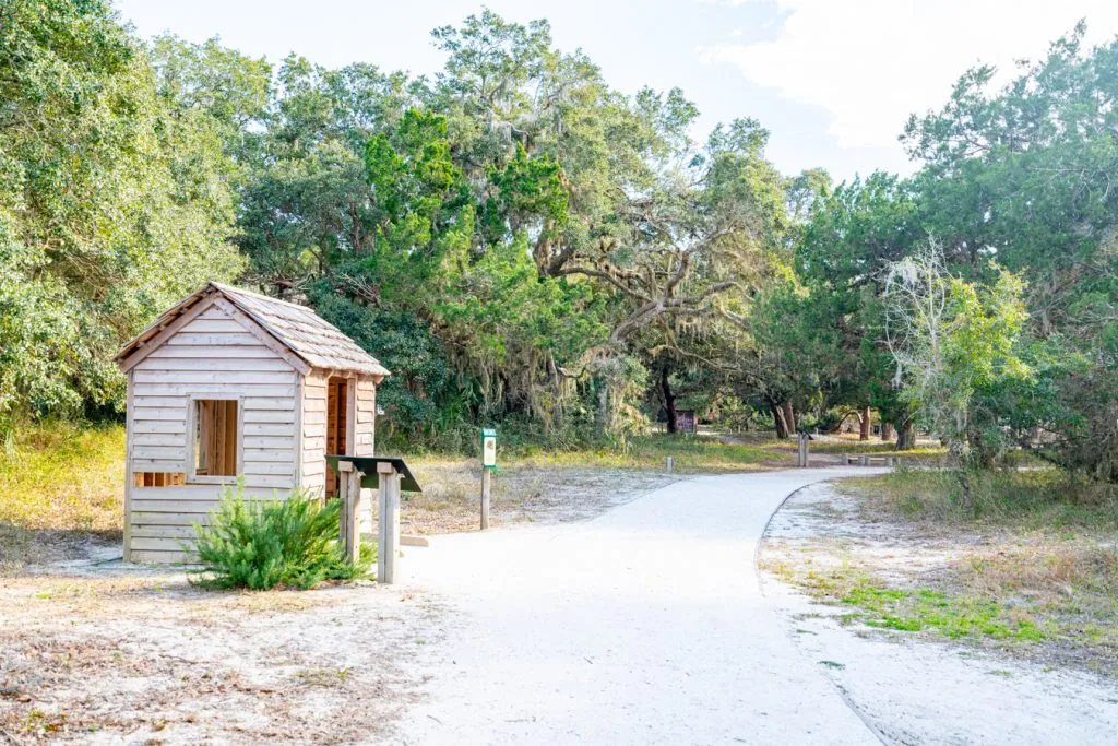 wanderer memory trail attraction jekyll island georgia with a small building to the side