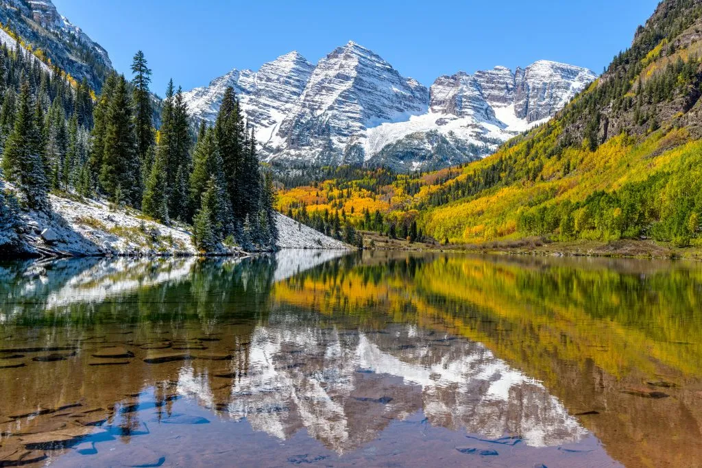 marroon bells snow covered mountains and lake in colorado