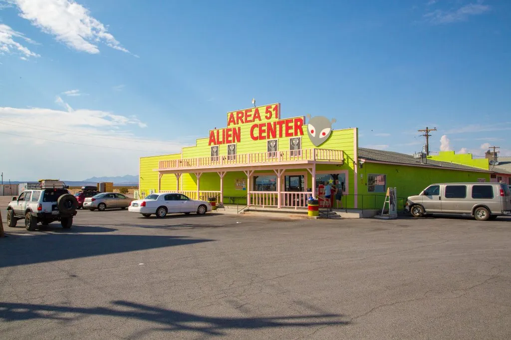 bright yellow building as seen on a nevada southwestern us road trip that reads "area 51 alien center" in red letters