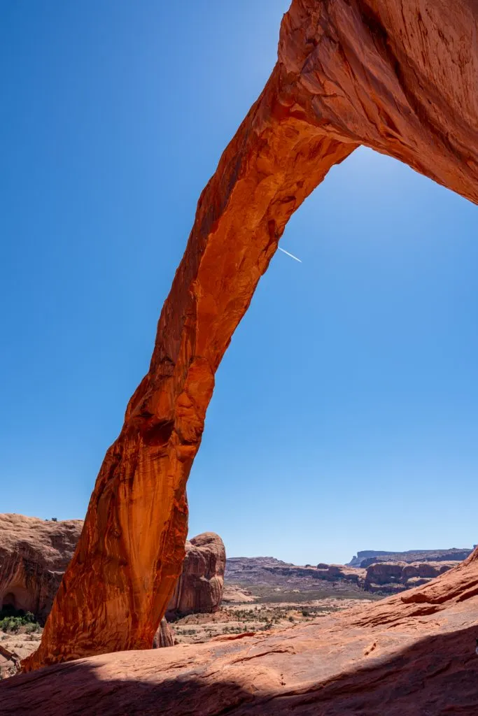 vertical photo of corona arch utah as taken from under the arch