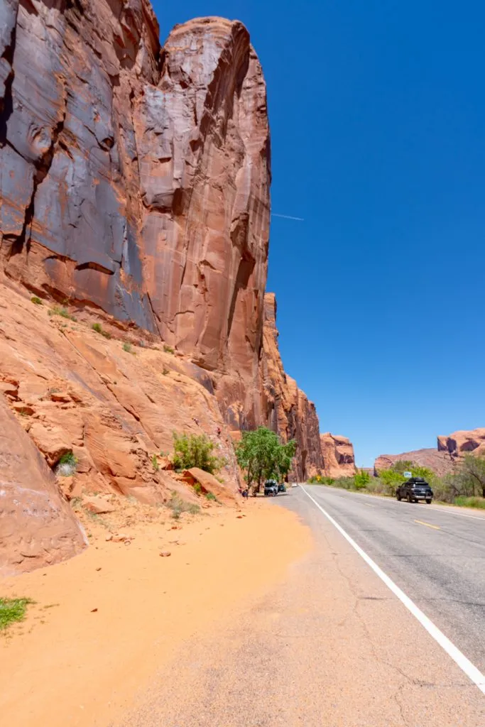 towering canyon walls along potash road, one of the best scenic drives to visit moab utah