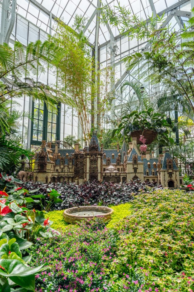 model of biltmore house inside conservatory. one of our tips for visiting biltmore is not to skip the conservatory