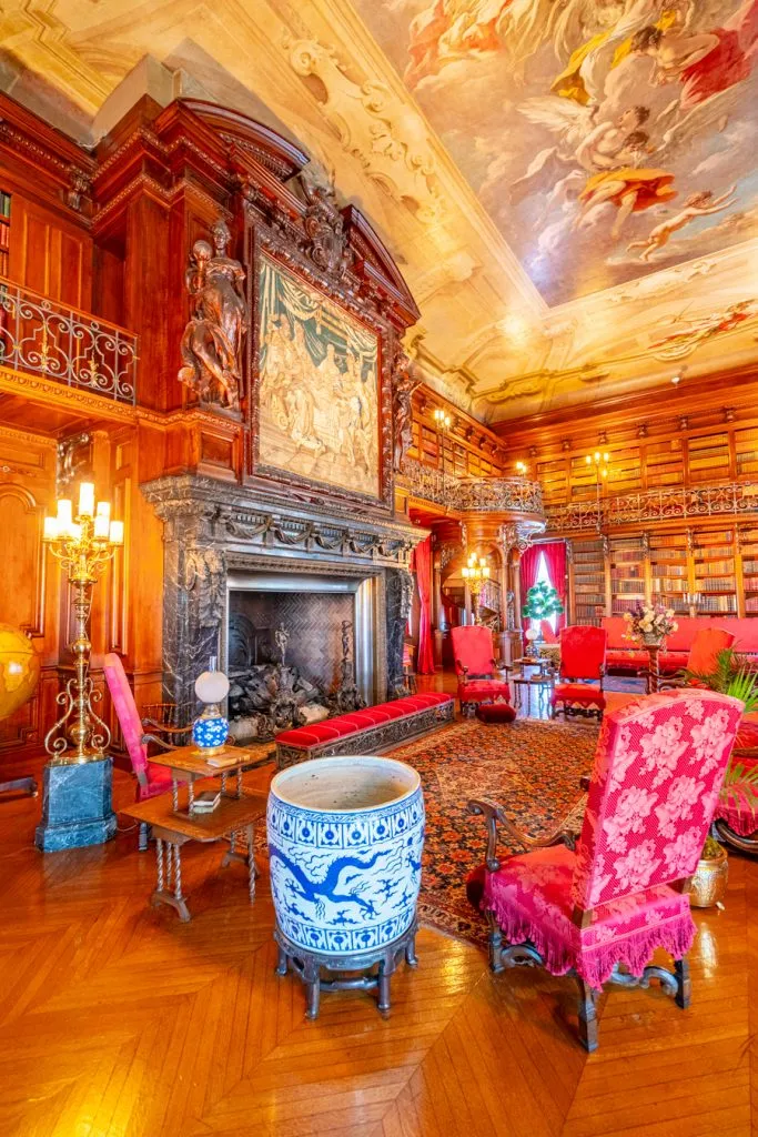 historic library with fireplace in biltmore house, one of the best places to visit at biltmore north carolina