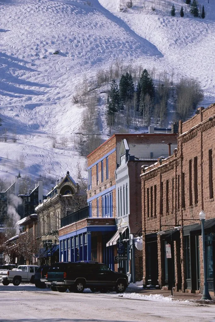 downtown aspen colorado in winter with snow in the background