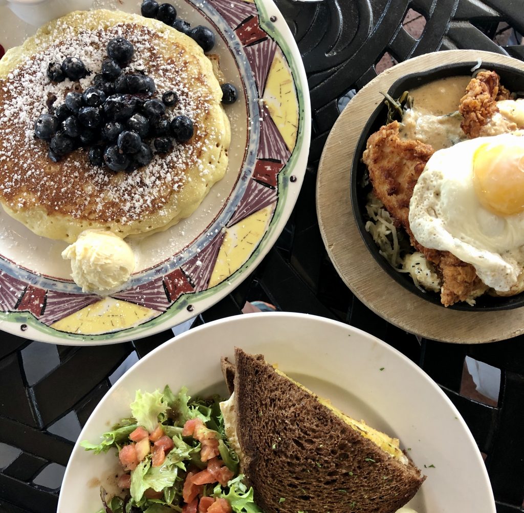 breakfast at miss shirleys baltimore as seen from above, with blueberry pancakes prominently featured